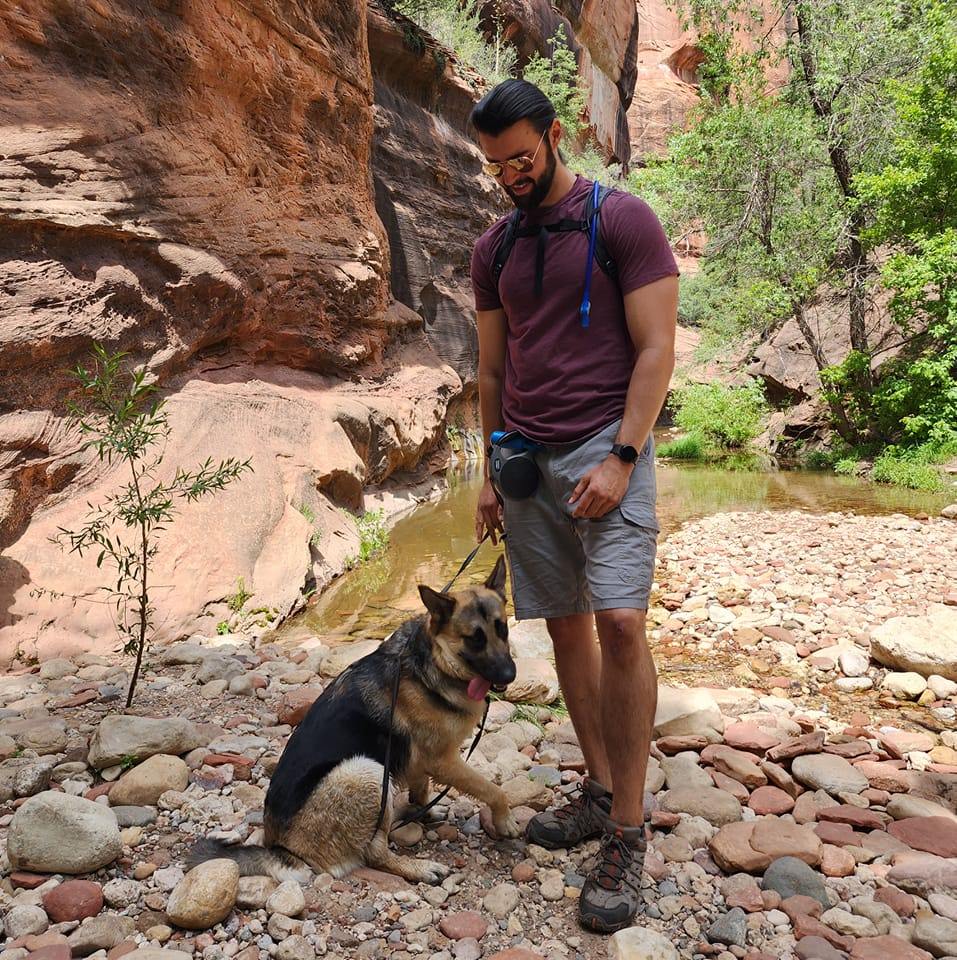 Travis Jones hiking with German Shepherd Freyja in Sedona Arizona red rock canyon